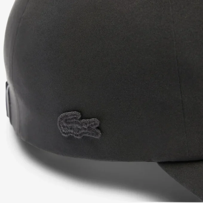 Casquette unisexe imperméable avec écusson Casquette unisexe imperméable avec écusson