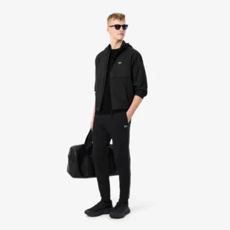 Pantalon de survêtement à rayures et logo