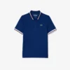 Polo de tennis à col rayé avec protection UV pour femme Polo de tennis à col rayé avec protection UV pour femme