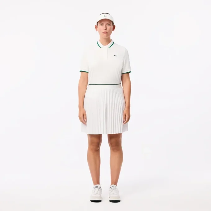 Polo de tennis à col rayé avec protection UV pour femme Polo de tennis à col rayé avec protection UV pour femme