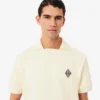 Polo en molleton ample orné d&rsquo;un écusson