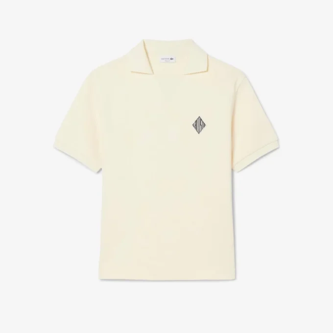 Polo en molleton ample orné d&rsquo;un écusson