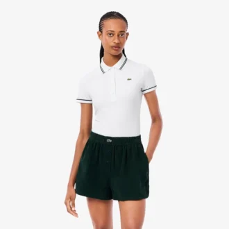 Polo femme L.12.D coupe ajustée avec bordures
