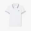 Polo femme L.12.D coupe ajustée avec bordures Polo femme L.12.D coupe ajustée avec bordures