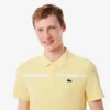 Polo Heritage de tennis pour homme avec badge Ultra Dry Polo Heritage de tennis pour homme avec badge Ultra Dry