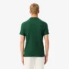 Polo Heritage de tennis pour homme avec badge Ultra Dry Polo Heritage de tennis pour homme avec badge Ultra Dry