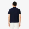 Polo Heritage de tennis pour homme avec badge Ultra Dry Polo Heritage de tennis pour homme avec badge Ultra Dry