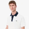 Polo L.12.12 pour homme, coupe classique et col contrasté Polo L.12.12 pour homme, coupe classique et col contrasté