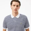 Polo L.12.12 rayé en petit piqué, coupe classique pour homme Polo L.12.12 rayé en petit piqué, coupe classique pour homme