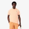 Polo Lacoste Tennis X Novak Djokovic sur le court Polo Lacoste Tennis X Novak Djokovic sur le court