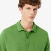Polos Petit Piqué à la coupe classique avec détails brodés Polos Petit Piqué à la coupe classique avec détails brodés