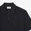 Polos Petit Piqué à la coupe classique avec détails brodés Polos Petit Piqué à la coupe classique avec détails brodés