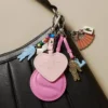 Porte-clés avec breloques en forme de raquette de tennis et miroir L Porte-clés avec breloques en forme de raquette de tennis et miroir L
