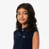 Robe polo sans manches en piqué stretch pour enfant Robe polo sans manches en piqué stretch pour enfant
