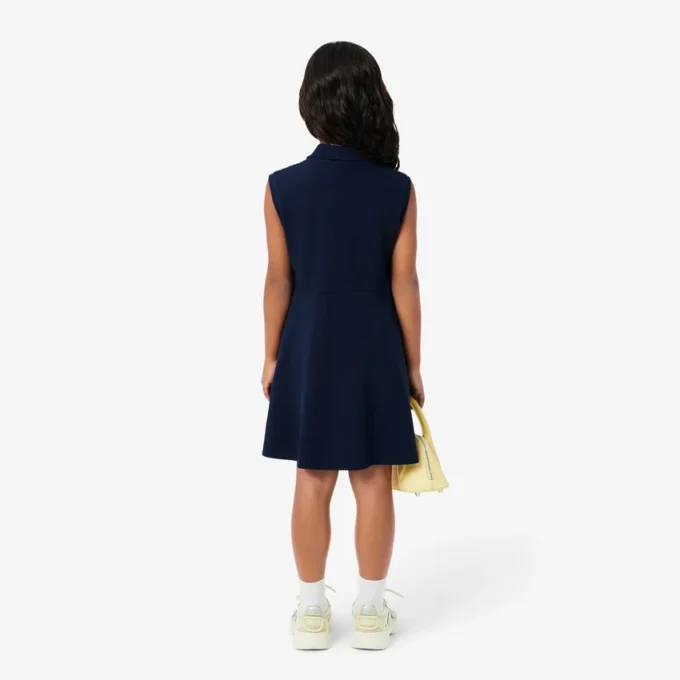 Robe polo sans manches en piqué stretch pour enfant Robe polo sans manches en piqué stretch pour enfant