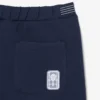 Short de tennis Heritage avec badge Ultra Dry Short de tennis Heritage avec badge Ultra Dry