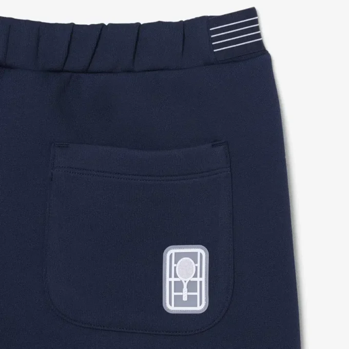 Short de tennis Heritage avec badge Ultra Dry Short de tennis Heritage avec badge Ultra Dry