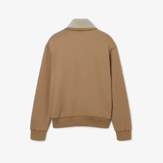 Sweats à col montant et fermeture éclair avec badge, inspirés des défilés