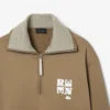 Sweats à col montant et fermeture éclair avec badge, inspirés des défilés