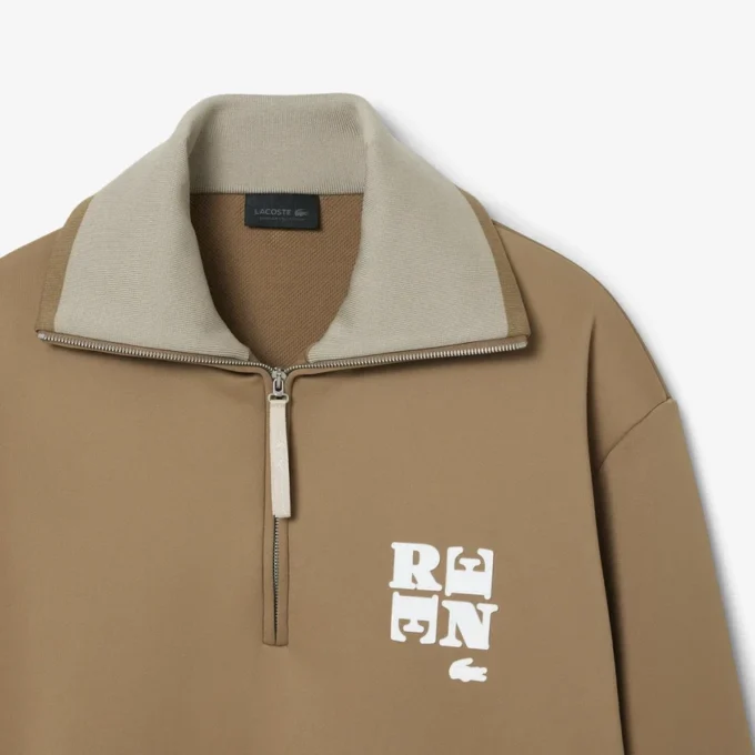 Sweats à col montant et fermeture éclair avec badge, inspirés des défilés