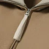 Sweats à col montant et fermeture éclair avec badge, inspirés des défilés