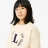 Sweats en néoprène avec écusson brodé Sweats en néoprène avec écusson brodé