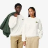 Sweats unisexes amples en molleton avec écusson Sweats unisexes amples en molleton avec écusson